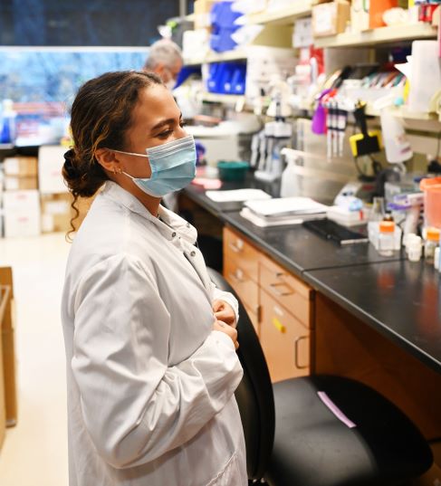 student working in lab coat